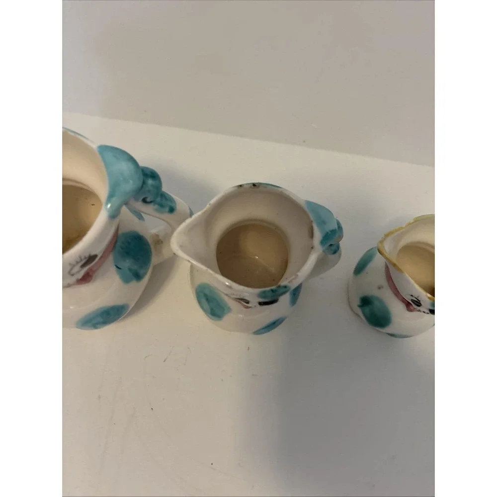 Vintage 1950s ceramic cat pitchers, creamers or part of measuring cup sets.